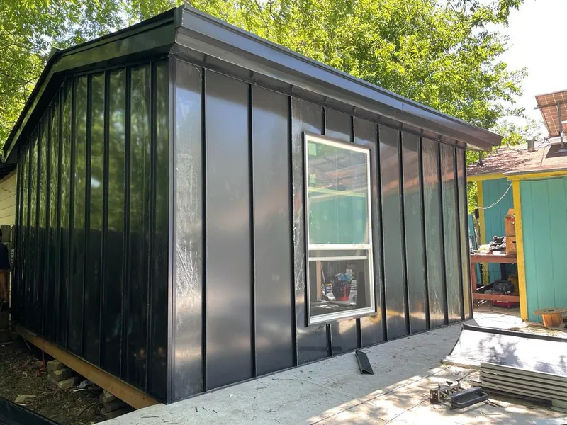 Black standing seam metal wall panels for Roof Inspection in Clermont