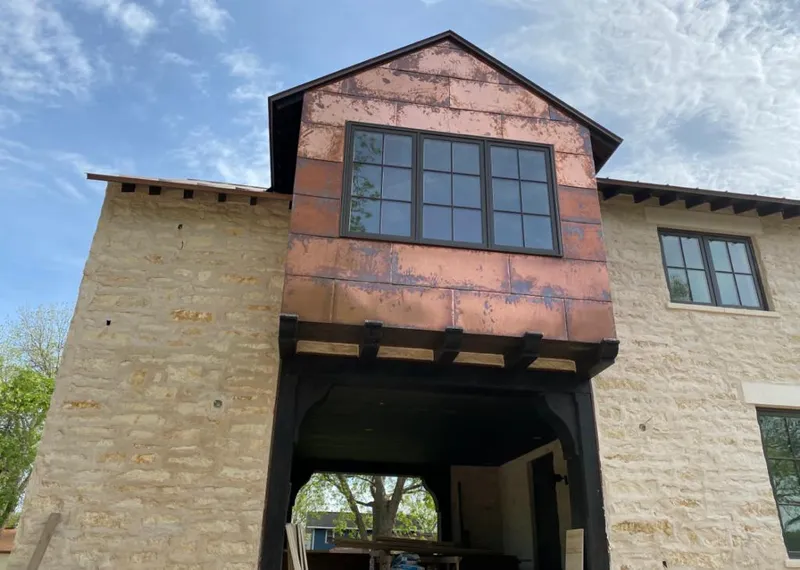 Copper metal panel facade on a stone building for Metal Roof Coating in Clermont